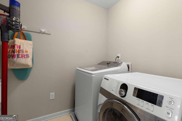 2759 Thomashire Trce, Marietta, GA 30066 - clothes washing area with washer and clothes dryer and baseboards