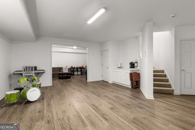 2759 Thomashire Trce, Marietta, GA 30066 - misc room featuring light wood-style flooring, stairs, and baseboards