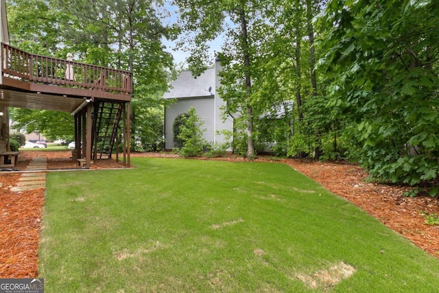 2759 Thomashire Trce, Marietta, GA 30066 - view of grassy yard featuring a deck and stairs