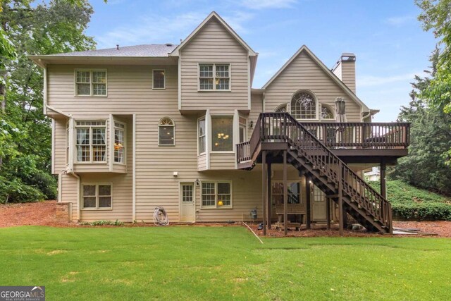 2759 Thomashire Trce, Marietta, GA 30066 - back of property with stairway, a wooden deck, a chimney, and a yard