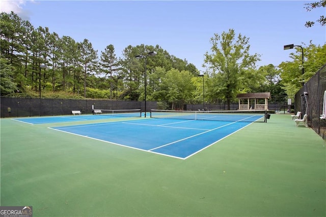 2759 Thomashire Trce, Marietta, GA 30066 - view of tennis court with fence and view of scattered trees