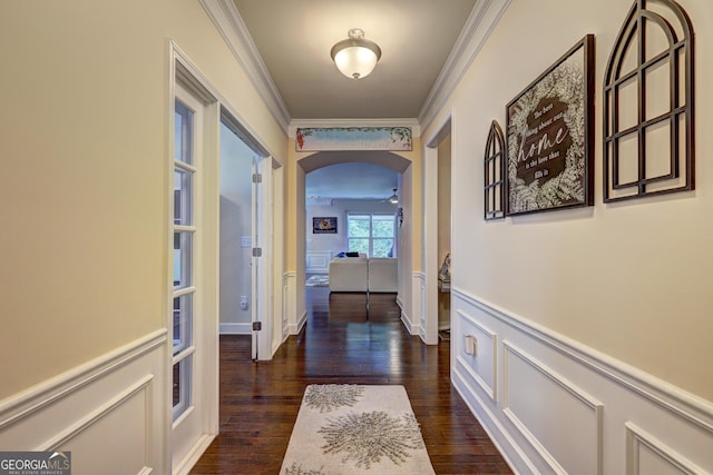 778 Firefly Ct, Griffin, GA 30223 - hallway with arched walkways, crown molding, and dark wood-style flooring