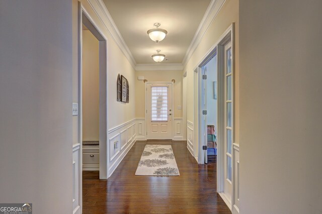 778 Firefly Ct, Griffin, GA 30223 - entryway featuring crown molding, dark wood-type flooring, a decorative wall, and wainscoting