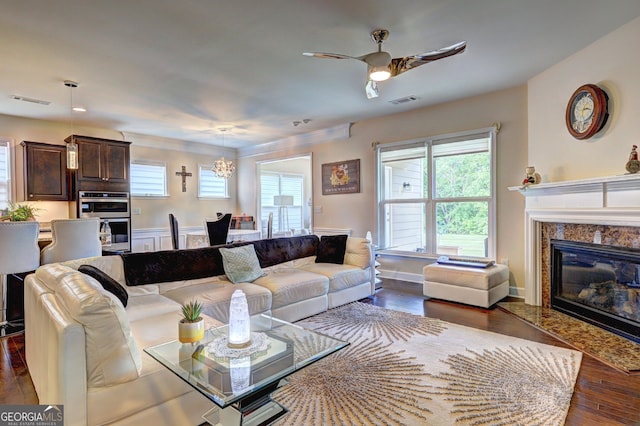 778 Firefly Ct, Griffin, GA 30223 - living room featuring ceiling fan, dark wood-style floors, and healthy amount of natural light