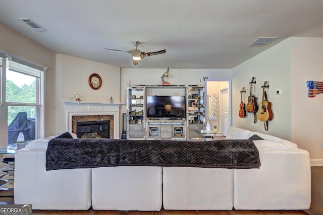 778 Firefly Ct, Griffin, GA 30223 - living area featuring ceiling fan, a fireplace, and wood finished floors