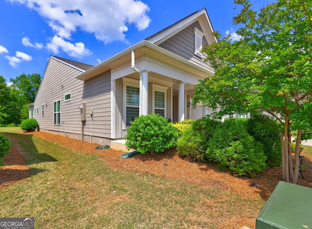 778 Firefly Ct, Griffin, GA 30223 - view of home's exterior featuring a porch and a lawn