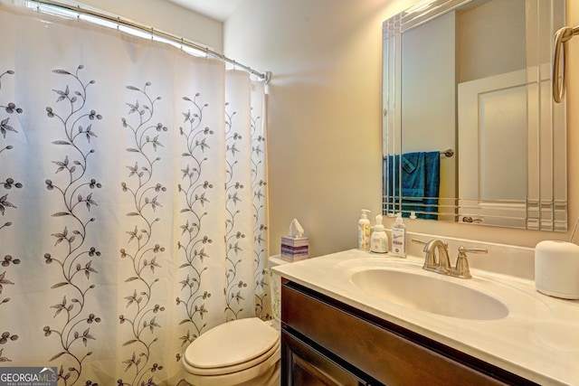 778 Firefly Ct, Griffin, GA 30223 - full bathroom featuring toilet, vanity, and a shower with shower curtain