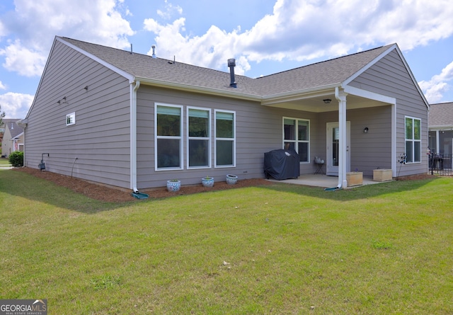 778 Firefly Ct, Griffin, GA 30223 - rear view of house featuring a patio and a lawn