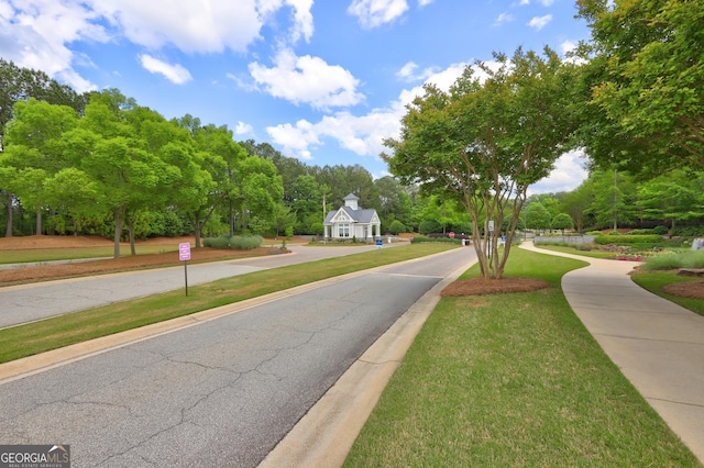 778 Firefly Ct, Griffin, GA 30223 - view of asphalt road with view of scattered trees, sidewalks, and curbs