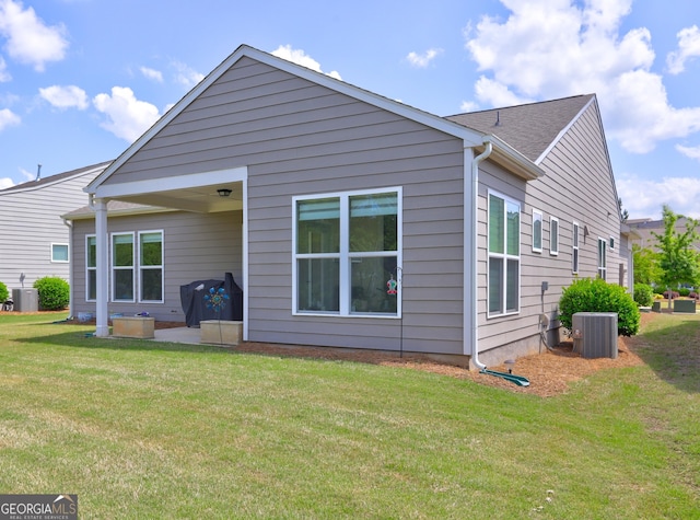 778 Firefly Ct, Griffin, GA 30223 - rear view of property with central air condition unit and a lawn