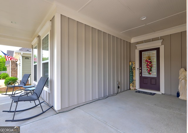 778 Firefly Ct, Griffin, GA 30223 - view of exterior entry featuring board and batten siding and a porch
