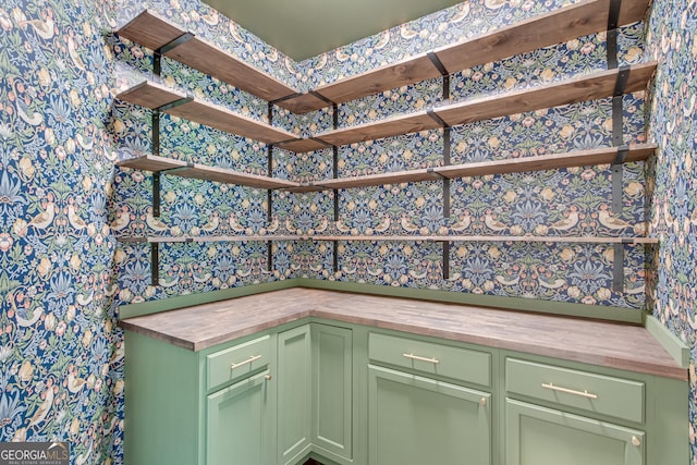 bar featuring wallpapered walls