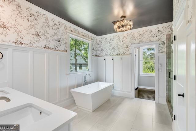 bathroom with a decorative wall, wallpapered walls, tile patterned floors, a freestanding tub, and a stall shower