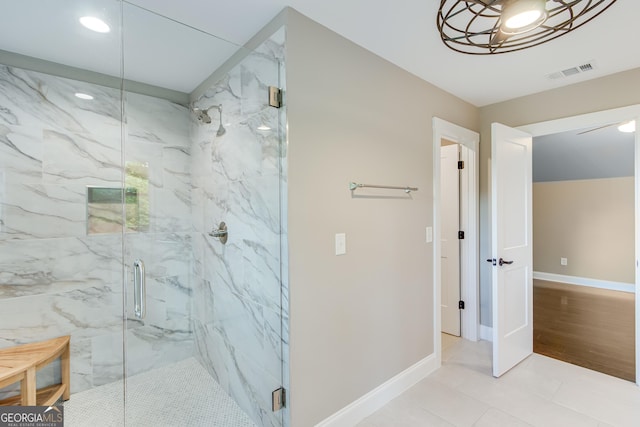full bathroom featuring a marble finish shower, baseboards, recessed lighting, and tile patterned flooring
