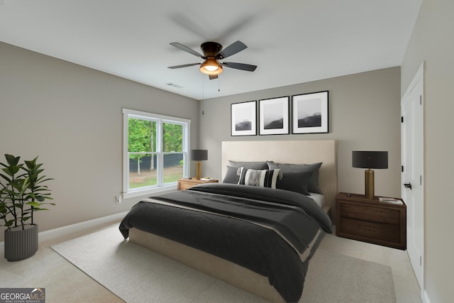 carpeted bedroom featuring baseboards and a ceiling fan