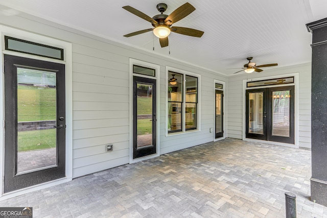 view of patio with ceiling fan and french doors