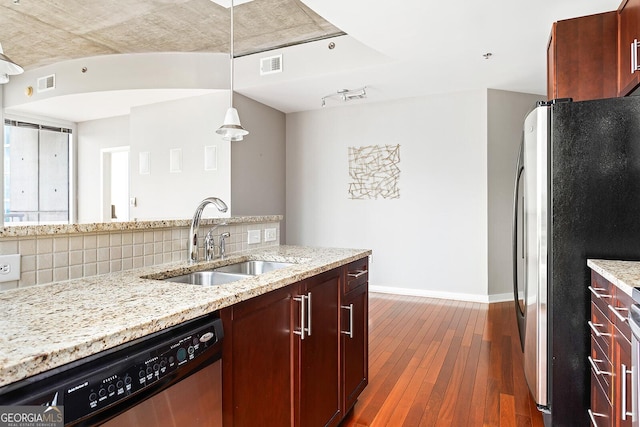 855 Peachtree St NE Unit 2203, Atlanta, GA 30308 - kitchen featuring stainless steel appliances, a sink, decorative backsplash, dark wood finished floors, and baseboards