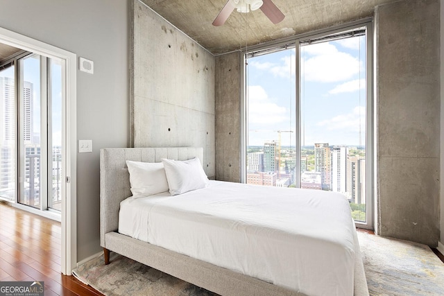 855 Peachtree St NE Unit 2203, Atlanta, GA 30308 - bedroom featuring a city view, access to exterior, multiple windows, and expansive windows