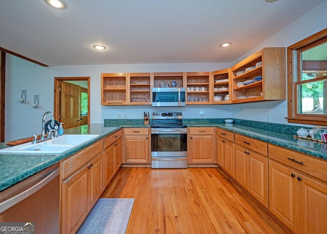 142 Hugh Dorsey Rd, Hartwell, GA 30643 - kitchen featuring stainless steel appliances, open shelves, a sink, light wood finished floors, and plenty of natural light