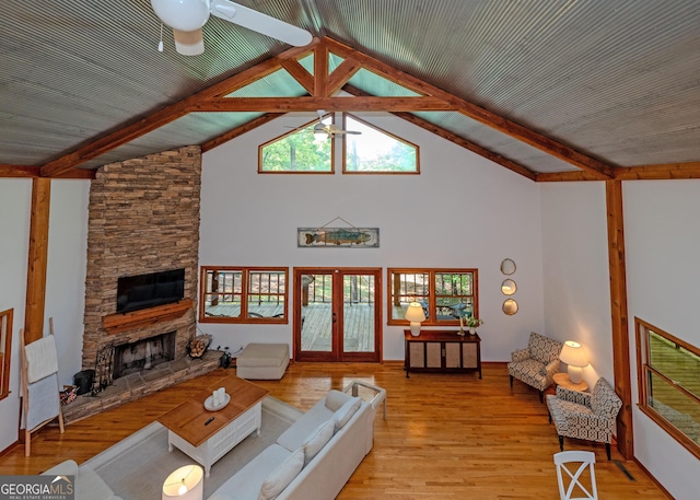 142 Hugh Dorsey Rd, Hartwell, GA 30643 - living room featuring ceiling fan, a fireplace, light wood-style floors, high vaulted ceiling, and beam ceiling