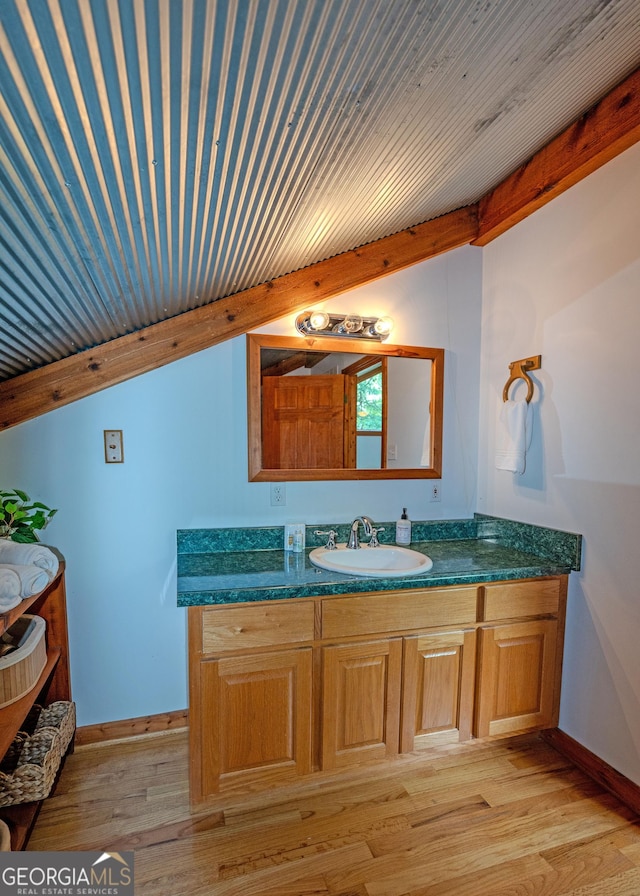 142 Hugh Dorsey Rd, Hartwell, GA 30643 - bathroom with wood finished floors, baseboards, and vanity