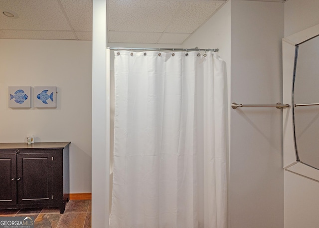 142 Hugh Dorsey Rd, Hartwell, GA 30643 - bathroom with a paneled ceiling, stone finish flooring, baseboards, and a shower with shower curtain