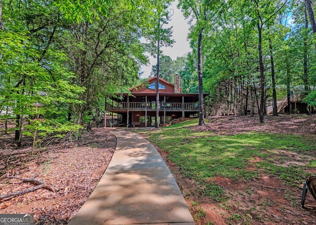 142 Hugh Dorsey Rd, Hartwell, GA 30643 - view of front of home featuring a chimney, a deck, and a wooded view