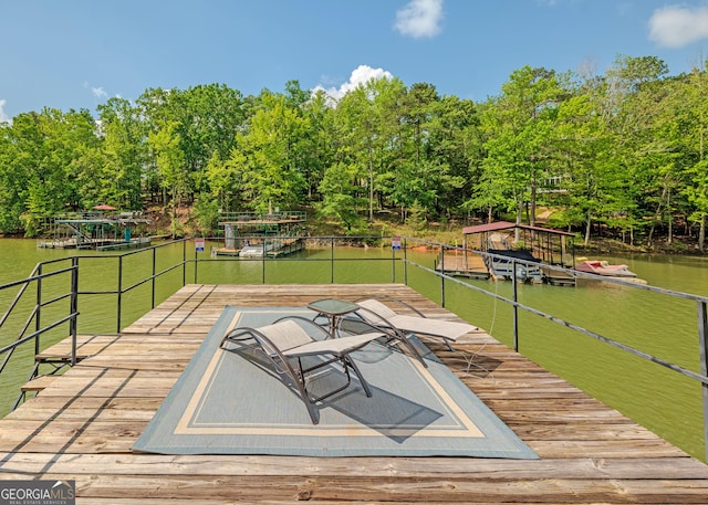 142 Hugh Dorsey Rd, Hartwell, GA 30643 - wooden deck featuring a floating dock, a water view, and view of wooded area
