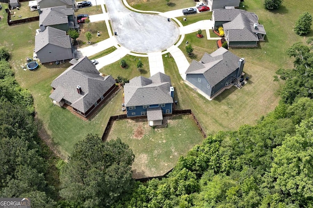 aerial view of property and surrounding area with nearby suburban area