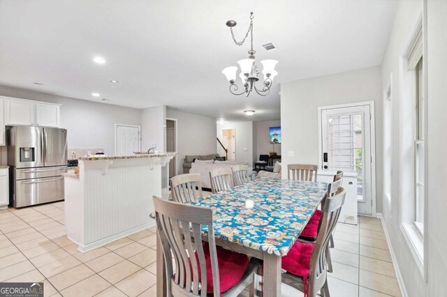 4960 Tadmore Ln, Lithonia, GA 30038 - dining space with light tile patterned floors, a chandelier, and recessed lighting