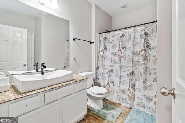 4960 Tadmore Ln, Lithonia, GA 30038 - bathroom with vanity, toilet, and curtained shower