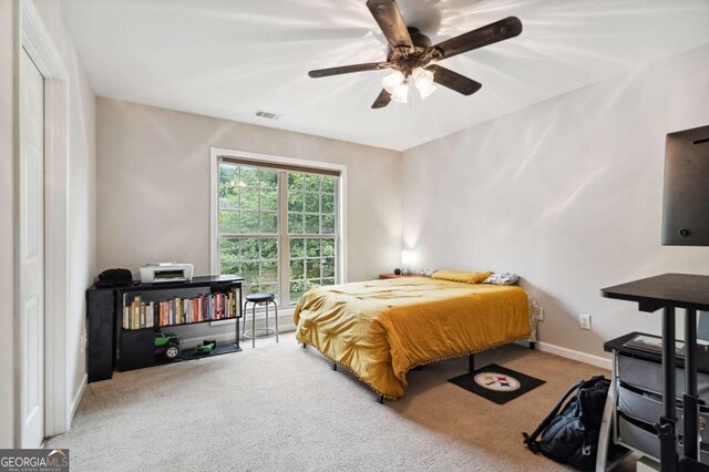 4960 Tadmore Ln, Lithonia, GA 30038 - bedroom featuring carpet flooring, baseboards, and a ceiling fan