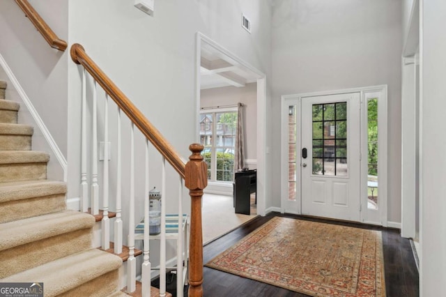 4960 Tadmore Ln, Lithonia, GA 30038 - foyer entrance featuring wood finished floors, stairway, and a towering ceiling