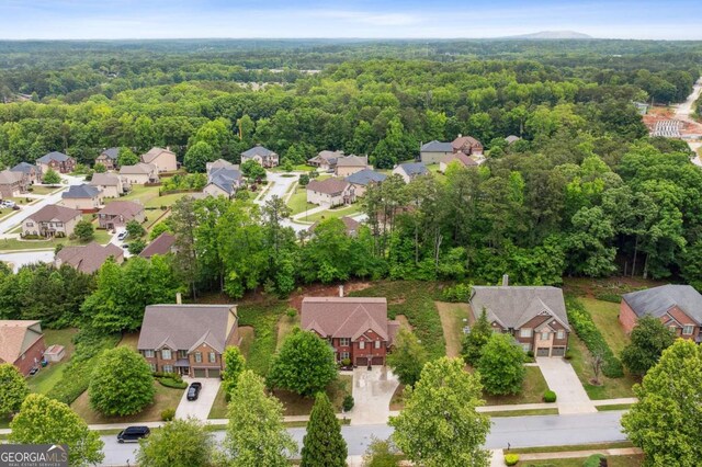 4960 Tadmore Ln, Lithonia, GA 30038 - aerial perspective of suburban area featuring a heavily wooded area