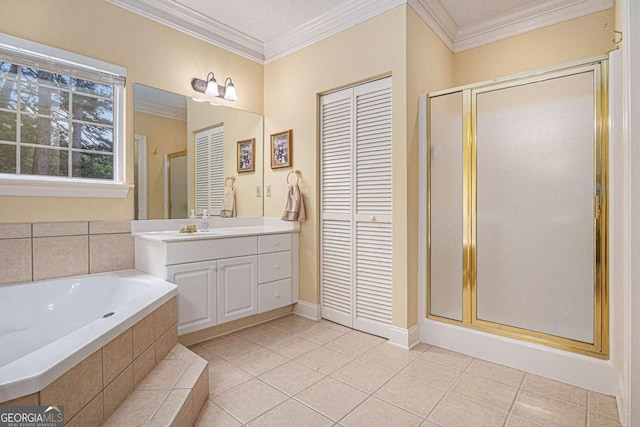 full bathroom with a stall shower, a bath, vanity, tile patterned flooring, and crown molding