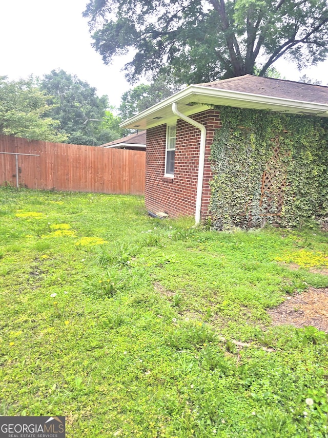 142 Wilshire Rd NE, Rome, GA 30161 - view of side of property with fence and brick siding
