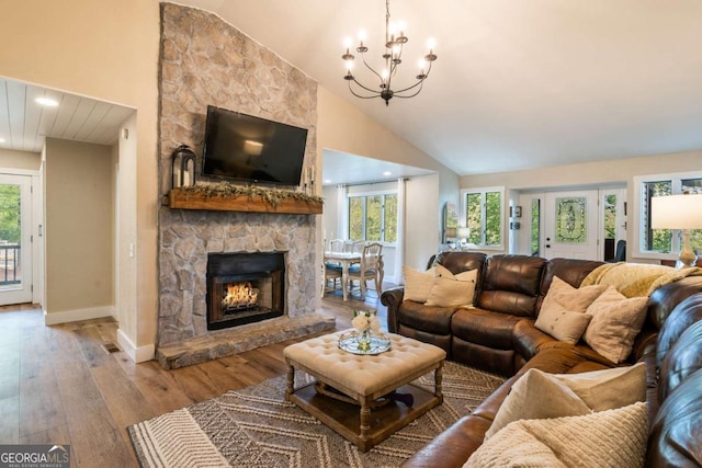 138 Mccombs Dr Unit 7, Blairsville, GA 30512 - living room featuring hardwood / wood-style flooring, a chandelier, baseboards, a fireplace, and high vaulted ceiling