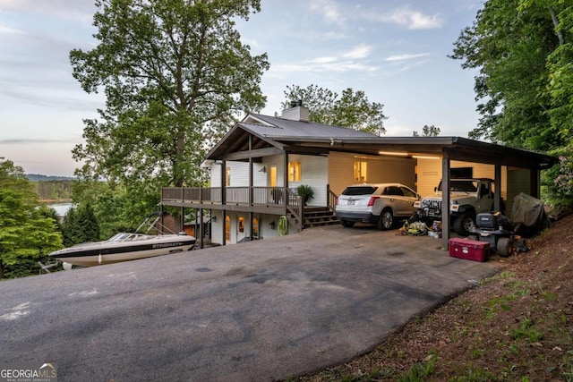138 Mccombs Dr Unit 7, Blairsville, GA 30512 - view of front of property with asphalt driveway, a chimney, and an attached carport