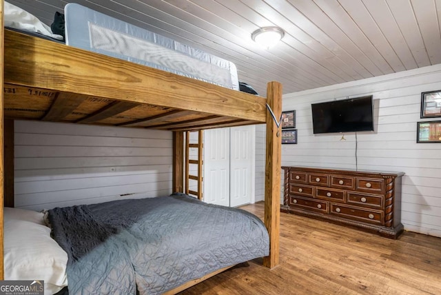 138 Mccombs Dr Unit 7, Blairsville, GA 30512 - bedroom with wooden walls, wood finished floors, and a closet