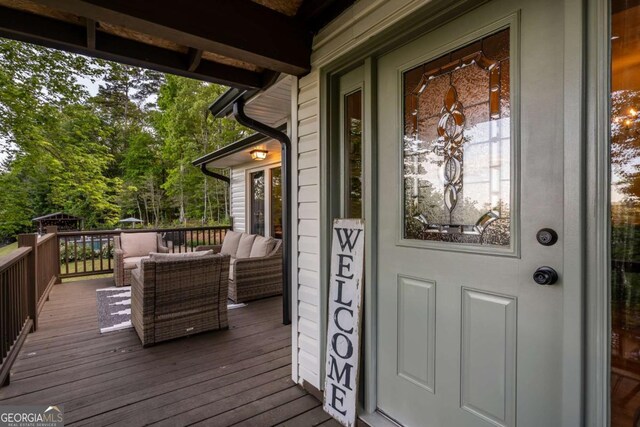 138 Mccombs Dr Unit 7, Blairsville, GA 30512 - view of exterior entry with an outdoor hangout area and a wooden deck