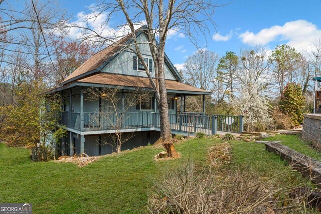 34 Instigator Cv, Dawsonville, GA 30534 - rear view of property featuring a yard and covered porch