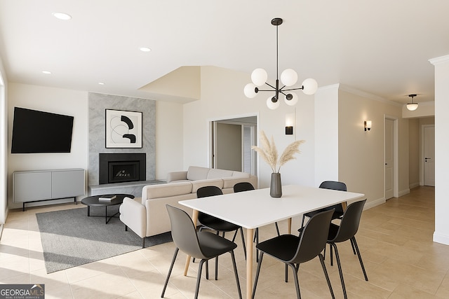 626 Palisade Dr, Ellijay, GA 30540 - dining room with a chandelier, recessed lighting, crown molding, light tile patterned flooring, and a high end fireplace