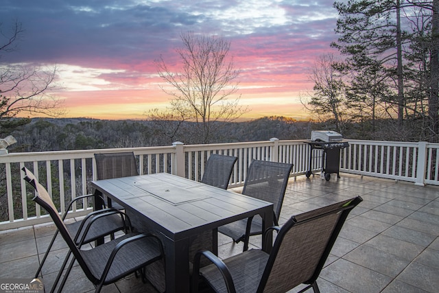 626 Palisade Dr, Ellijay, GA 30540 - patio terrace at dusk with outdoor dining area and grilling area