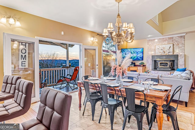 626 Palisade Dr, Ellijay, GA 30540 - dining room with a chandelier and a tile fireplace