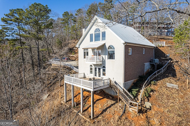 626 Palisade Dr, Ellijay, GA 30540 - view of side of home with a balcony, stairway, a metal roof, a wooden deck, and a chimney