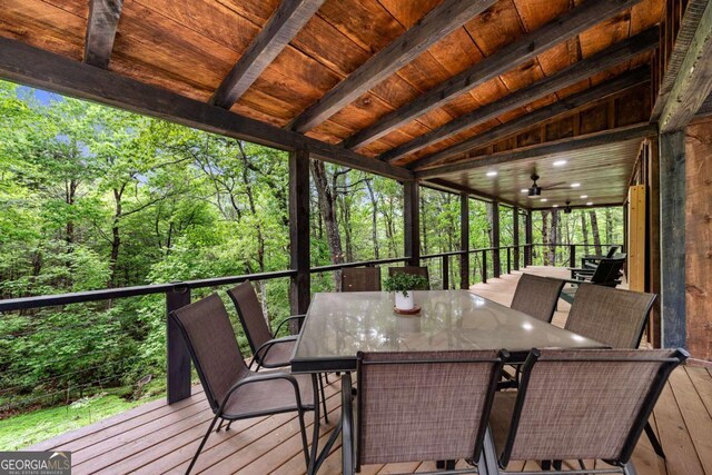 sunroom with outdoor dining area