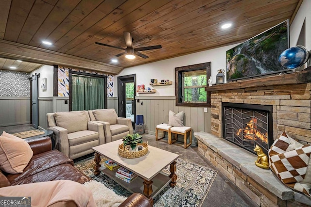 living area with a wainscoted wall, wood ceiling, a fireplace, a ceiling fan, and recessed lighting