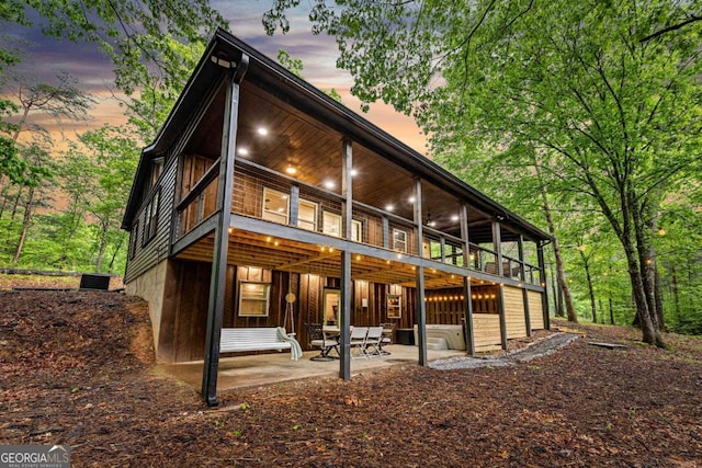 back of property featuring a patio area