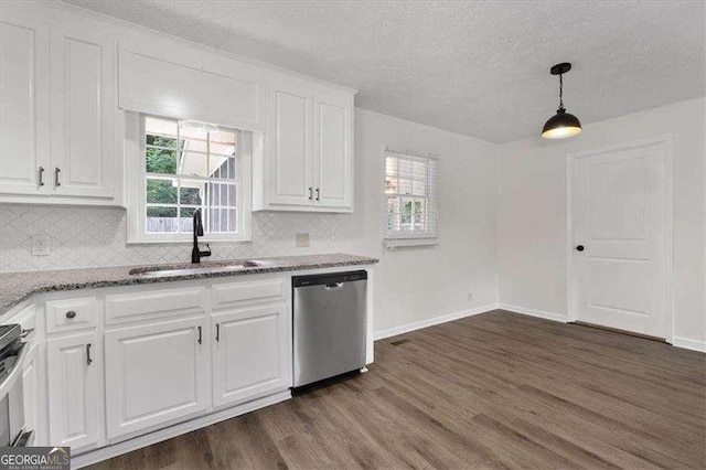 kitchen featuring dishwasher, a sink, dark wood-type flooring, white cabinetry, and decorative backsplash