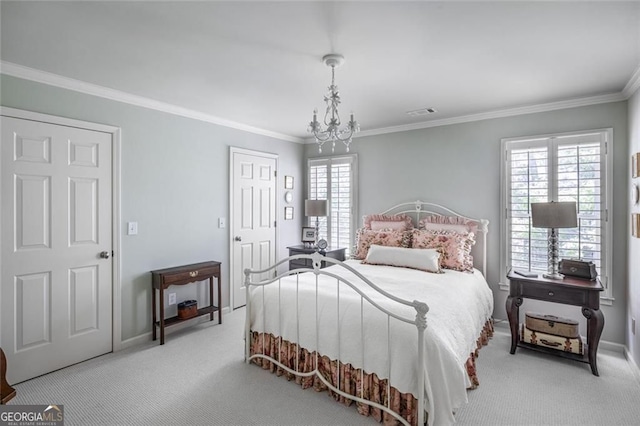 carpeted bedroom with crown molding, multiple windows, baseboards, and a chandelier
